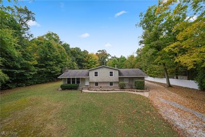 Split level home with a front lawn | Image 1