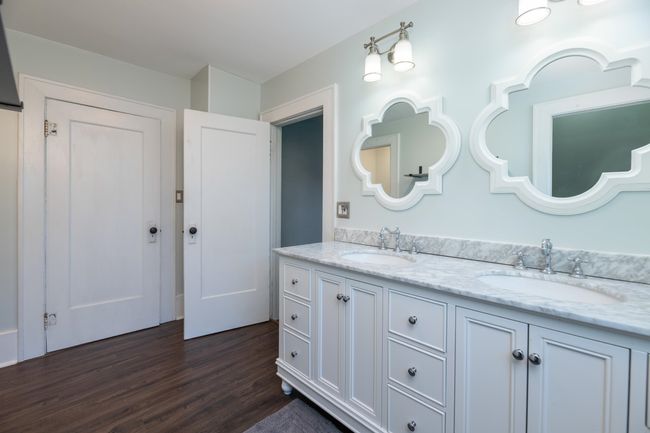 Full bathroom featuring wood finished floors and double vanity | Image 24