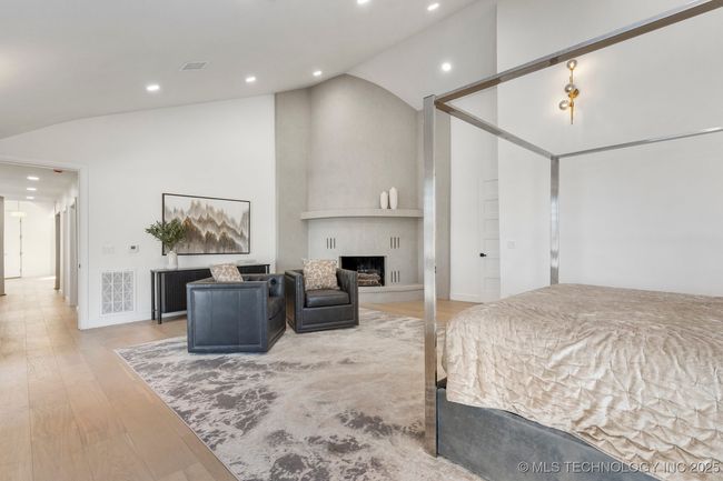 Huge primary suite with floor to ceiling stucco fireplace | Image 44