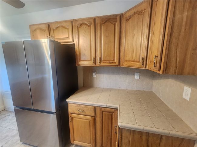 Nice cabinets and a brand-new fridge. | Image 17