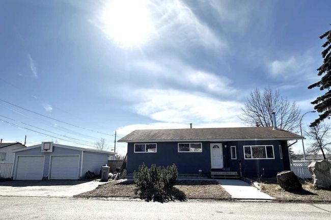 9239 107 Avenue, Home with 4 bedrooms, 2 bathrooms and 4 parking in Grande Prairie AB | Image 1