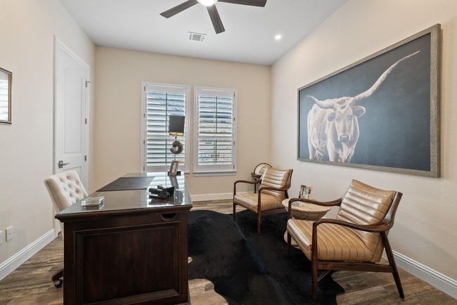 Office with dark wood-type flooring, ceiling fan, and baseboards | Image 26
