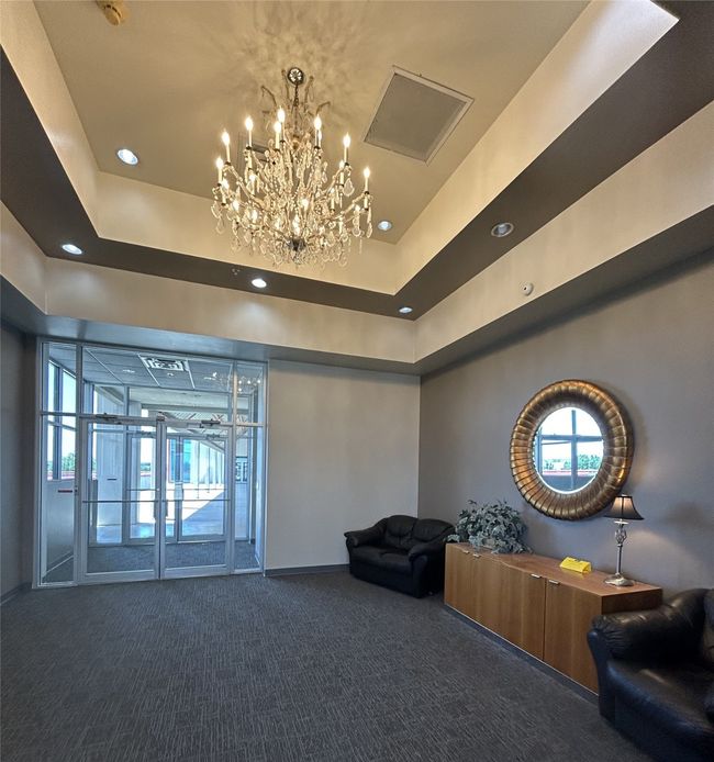 Beautiful chandelier in lobby area | Image 31