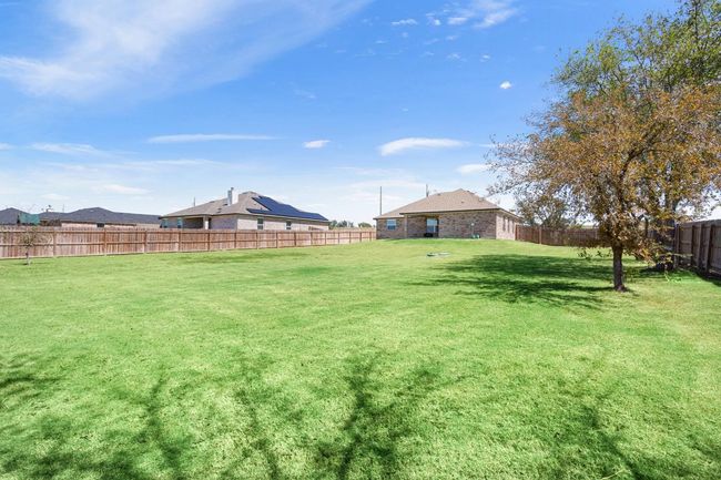 View of fenced backyard | Image 30