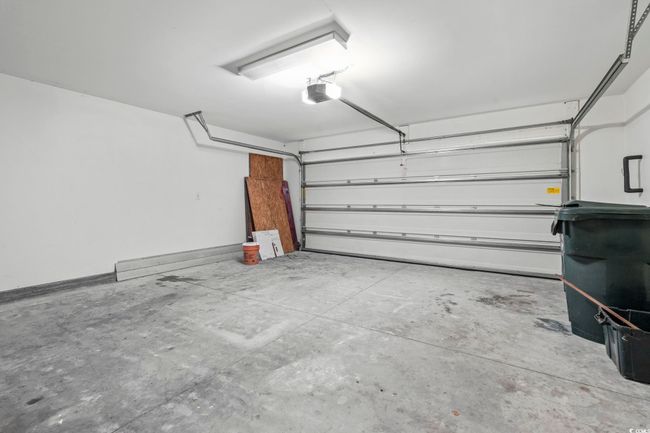Garage with a garage door opener | Image 22