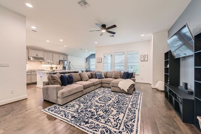 Living room with hardwood / wood-style floors, a ceiling fan, and recessed lighting | Image 6