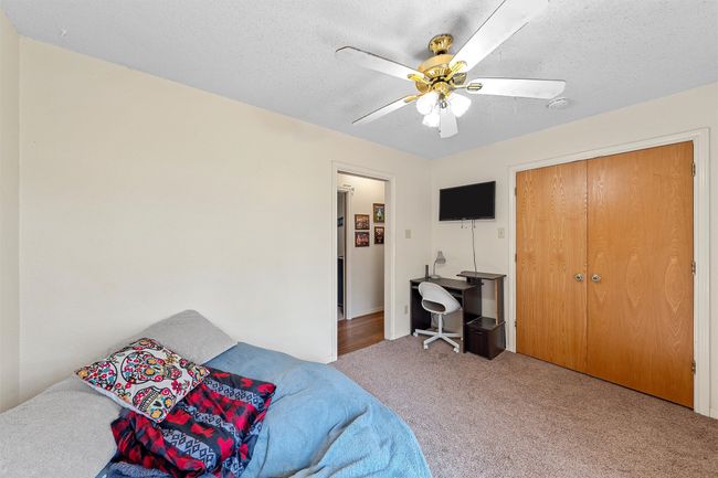 Carpeted bedroom featuring ceiling fan | Image 22