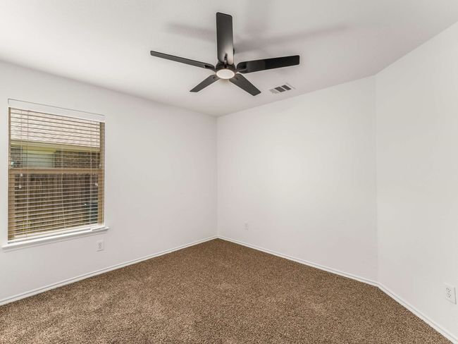 Empty room with carpet and a ceiling fan | Image 23