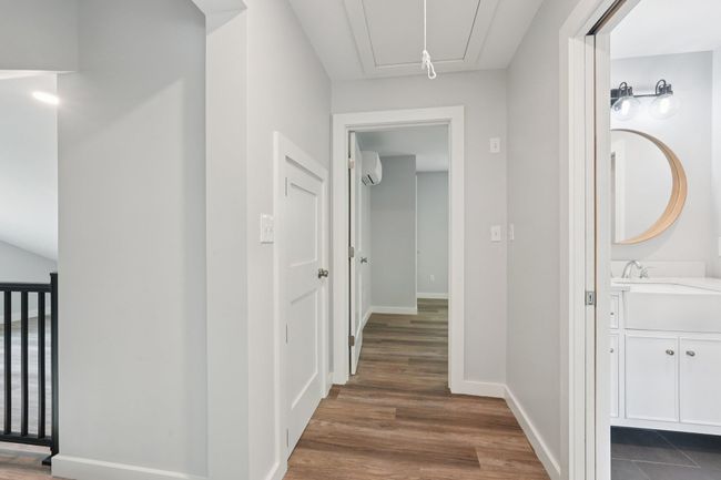 Corridor featuring attic access, AC/heat split mini, dark wood-type flooring | Image 20
