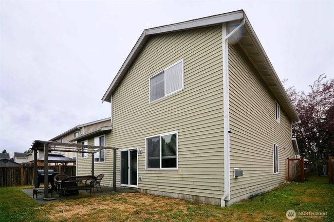 Back yard has plenty of room for entertaining on the patio with the pergola side area. Fully fenced. | Image 32