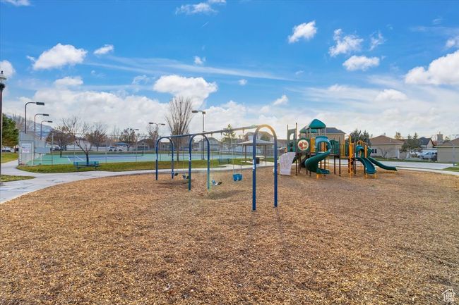 Community play area featuring fence | Image 49