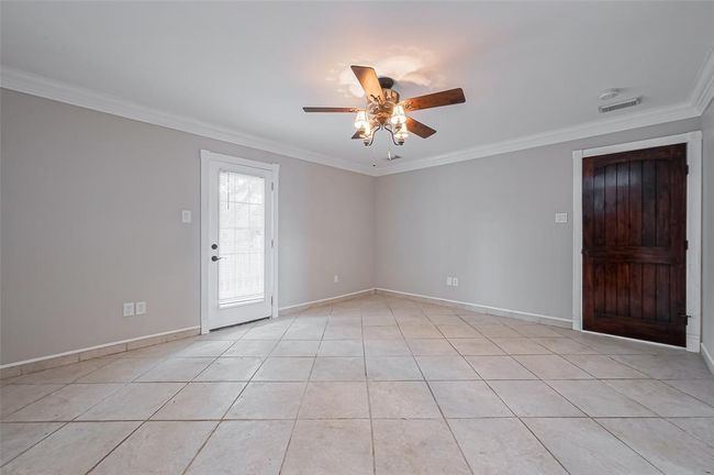 First floor primary, with door to front porch. | Image 25