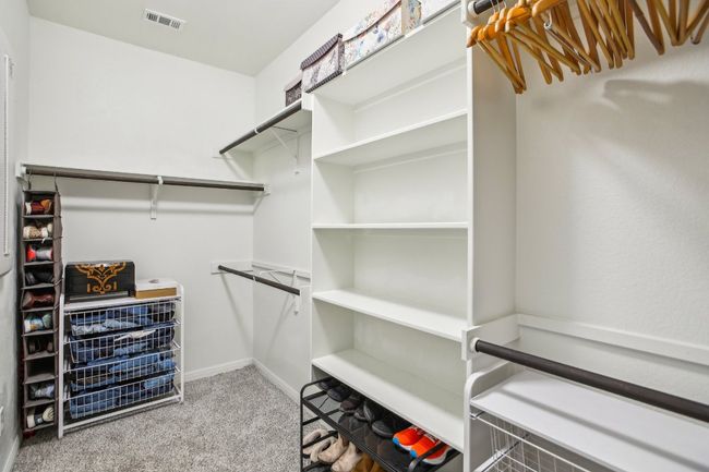 Walk in closet with carpet flooring | Image 20
