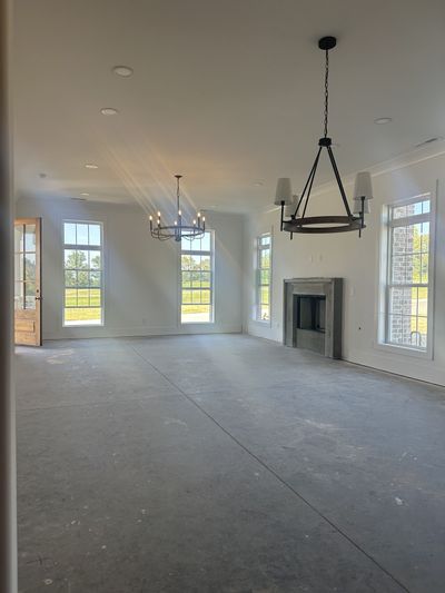 Open Living Area with a Custom Fireplace | Image 2