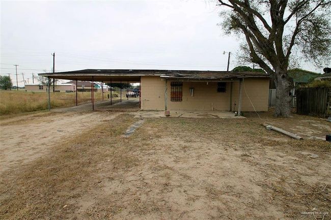 Rear view of property with a carport | Image 14