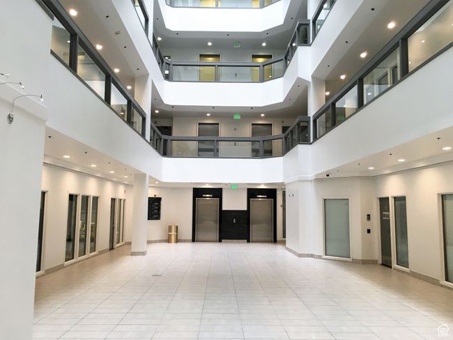 Common area featuring a towering ceiling | Image 7