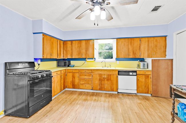 An abundance of cabinets allows for extra storage. | Image 13