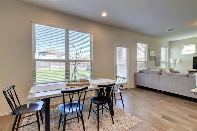 Dining space with light wood-style flooring and recessed lighting | Image 13