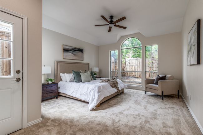 Carpeted bedroom with baseboards, a ceiling fan, and vaulted ceiling | Image 20