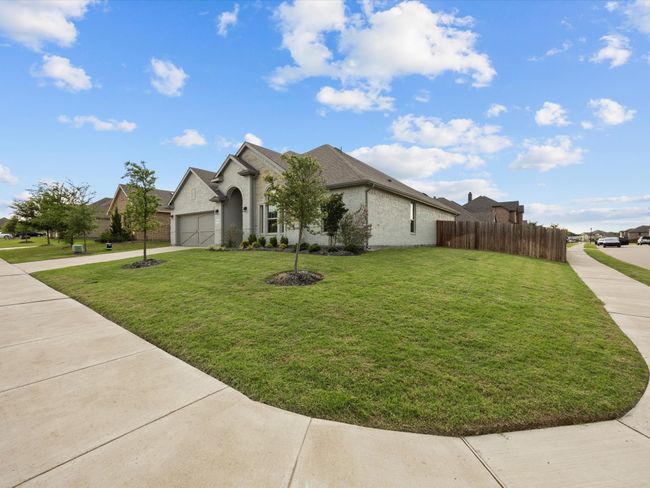 View of front of house featuring concrete driveway and a garage | Image 29
