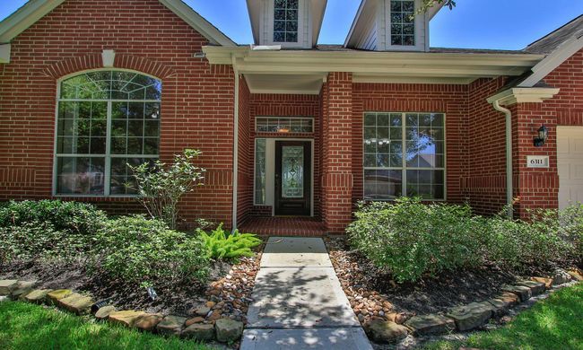 The covered front porch with room for seating is a great spot to chat with neighbors | Image 5