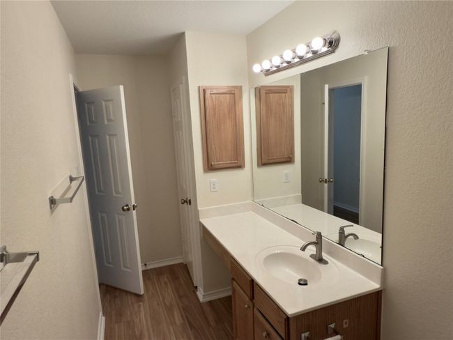 Bathroom with wood finished floors and vanity | Image 22