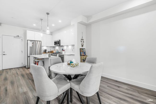 Dining space featuring light wood-style floors and recessed lighting | Image 5
