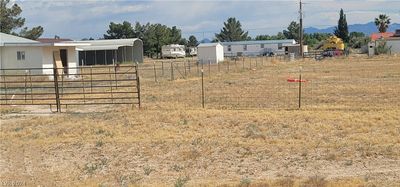 Wire Fenced on all sides with double gate entrance to property from the street. | Image 2