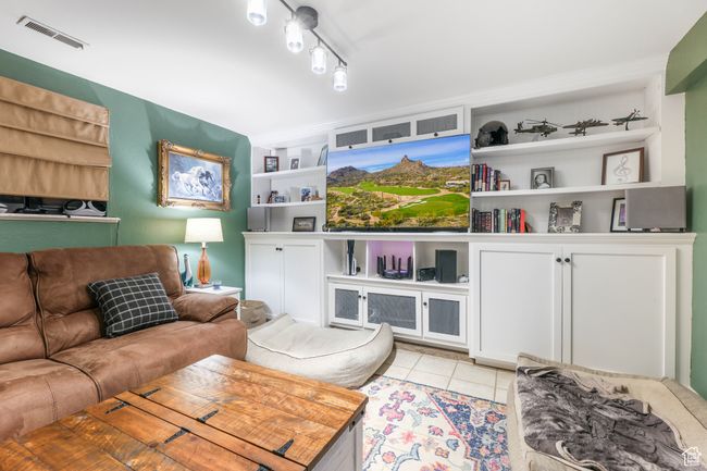 Living area with visible vents and light tile patterned flooring | Image 30