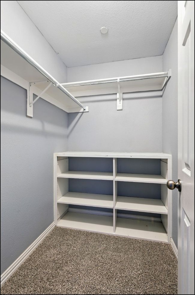 Spacious closet with carpet flooring | Image 30