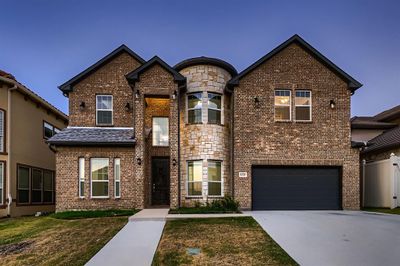 View of front of property featuring a garage | Image 1