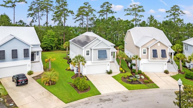 View of front facade featuring stairs, a garage, and concrete driveway | Image 30