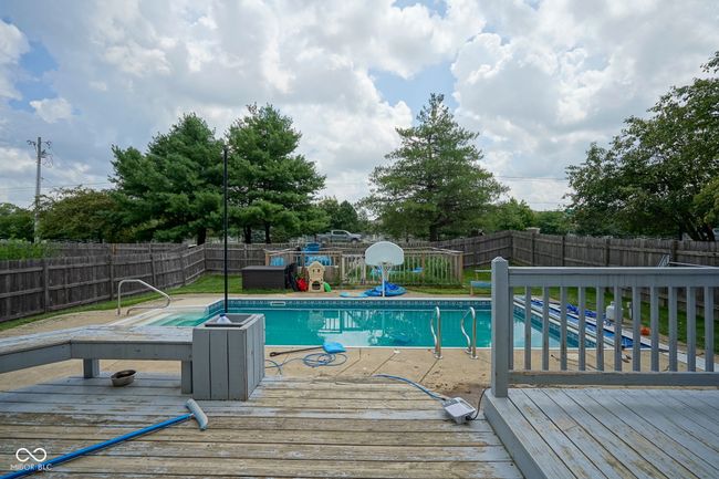 view of pool featuring a wooden deck and a fenced backyard | Image 38