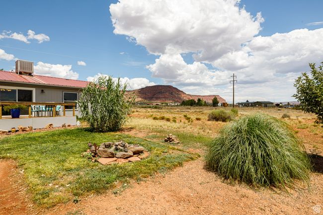 View of yard featuring a mountain view and cooling unit | Image 30