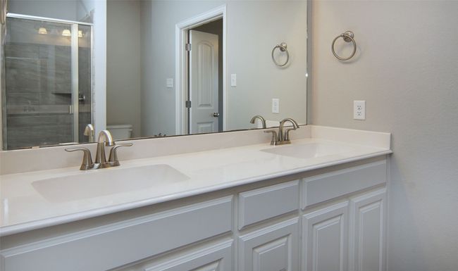 Full bath featuring double vanity and tiled shower | Image 6