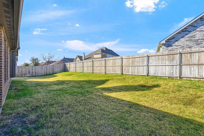 Enjoy privacy and seclusion with a fully fenced backyard. | Image 30