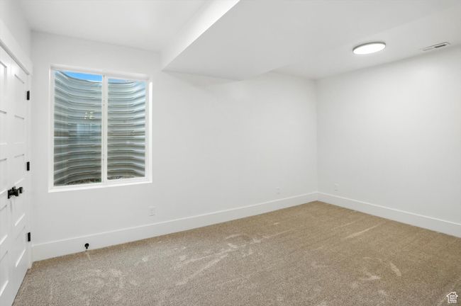 Carpeted spare room featuring baseboards | Image 44