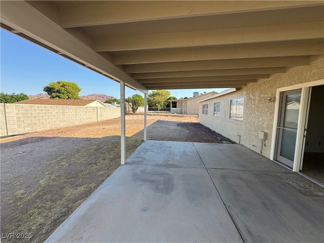 Fenced backyard featuring a patio | Image 24