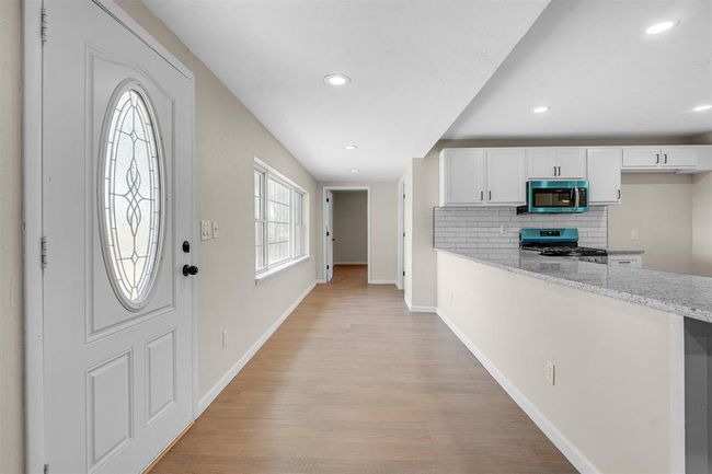 Foyer entrance with light wood-type flooring | Image 11