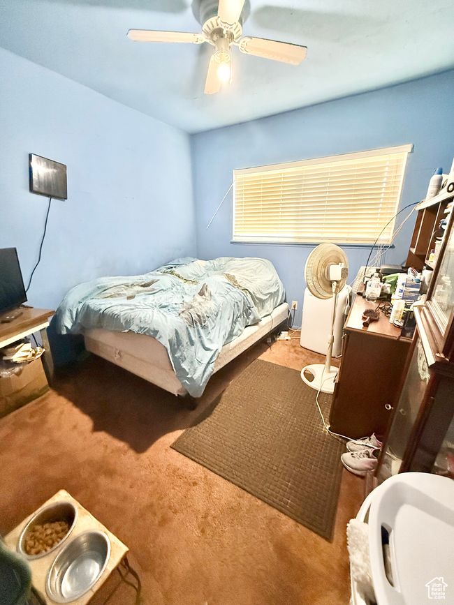 Carpeted bedroom featuring a desk and ceiling fan | Image 11