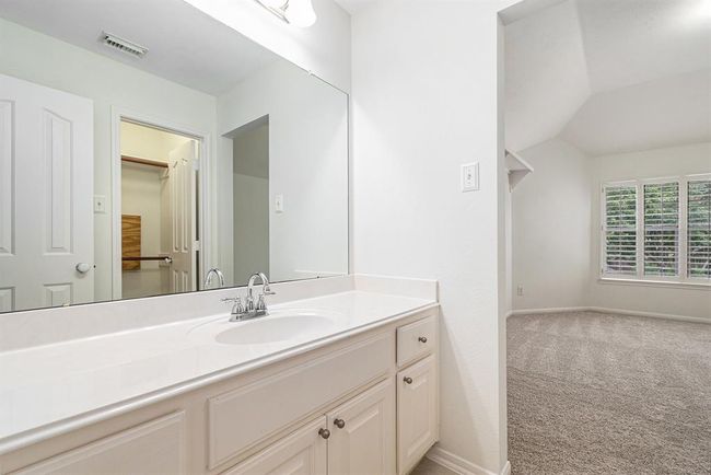 The secondary vanity space with these attached bedrooms! | Image 33