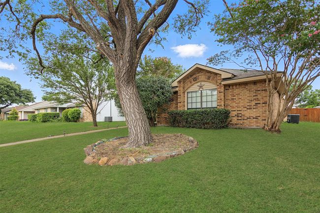 Single story home with brick siding and roof with shingles | Image 26