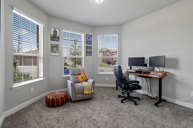 Carpeted office space featuring baseboards | Image 14