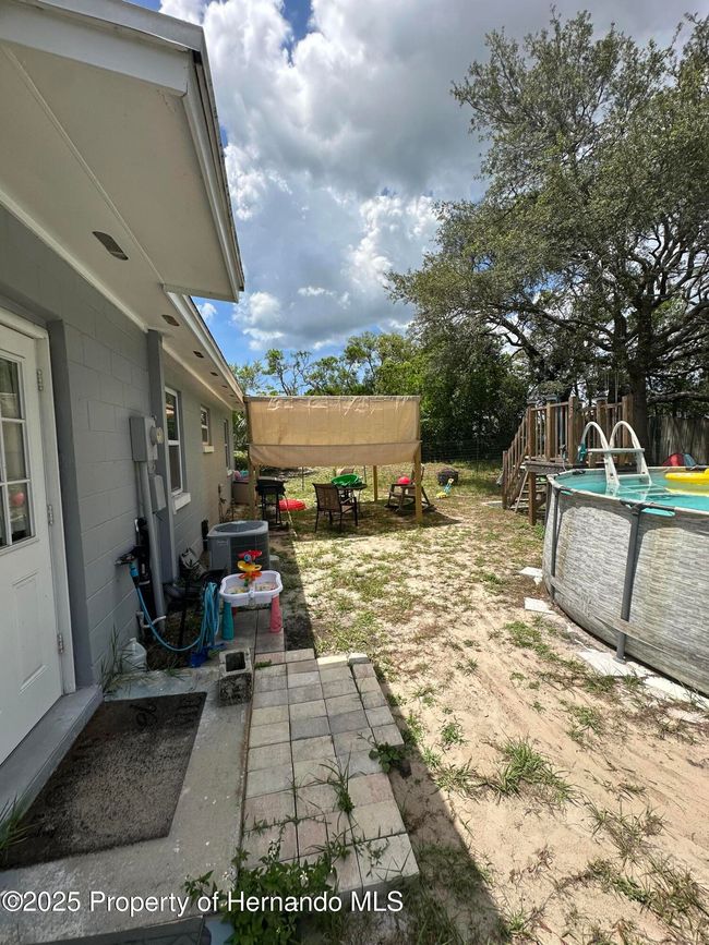 Fenced Back yard and above ground pool | Image 17