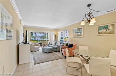 Tile floors. crown molding, beautifully furnished. | Image 1