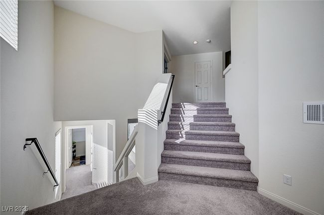 Entranceway showing stairs to Second and Downstairs Floors | Image 5