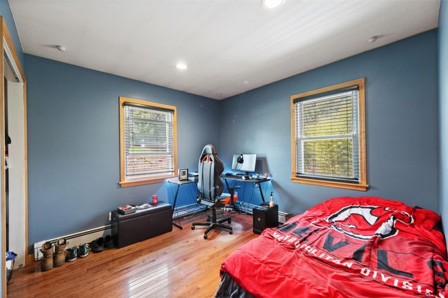 Bedroom featuring wood finished floors and recessed lighting | Image 16