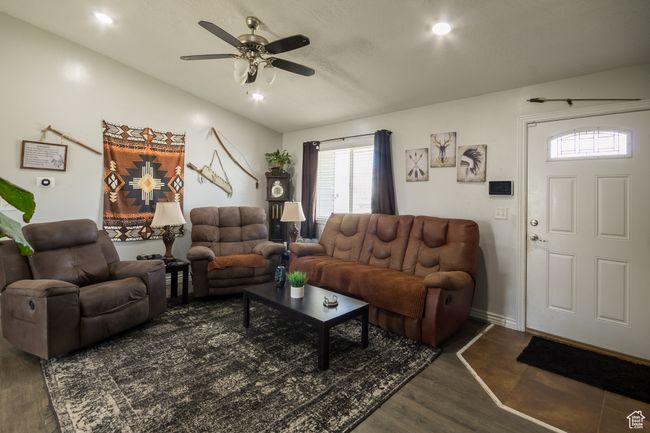 Living room featuring ceiling fan, a wealth of natural light, wood finished floors, and recessed lighting | Image 5