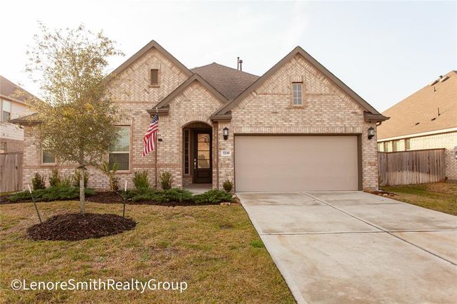 Charming Lennar single-story brick home with a gabled roof and a two-car garage. The house features a welcoming front entry and well-maintained landscaping | Image 11