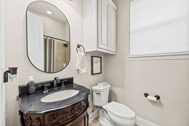 Full bath featuring toilet, vanity, baseboards, and a shower with shower curtain | Image 14